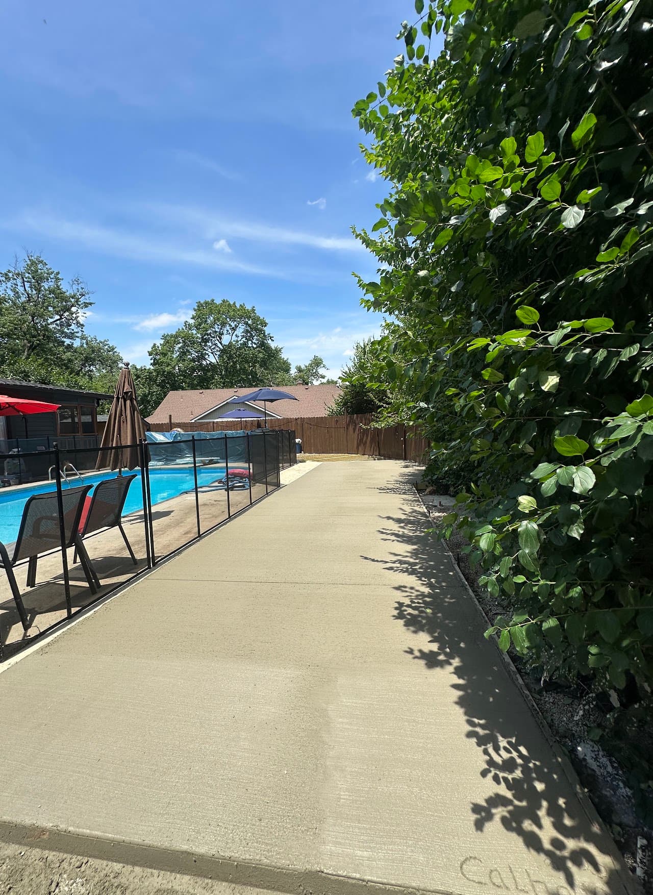 Concrete patio addition behind a brick home in Ohio