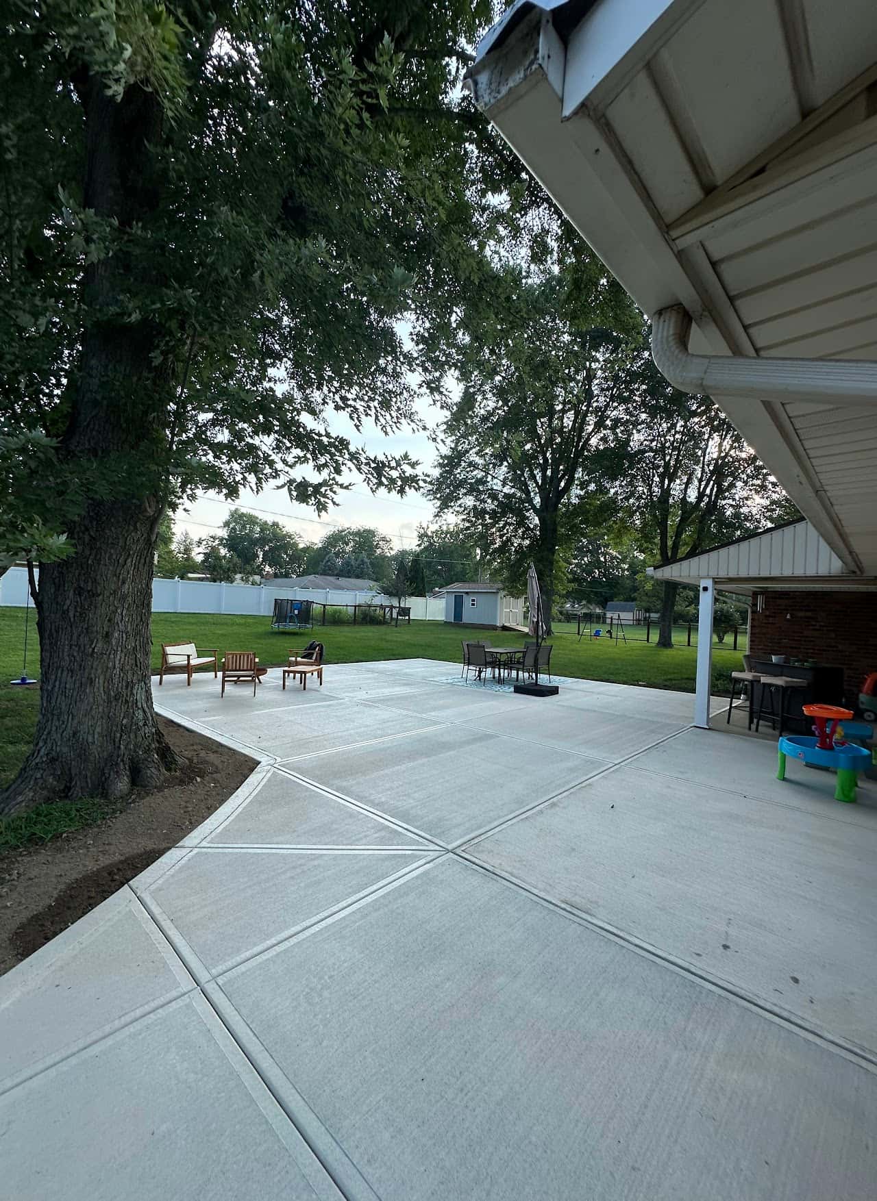 Stamped concrete patio under a backyard awning